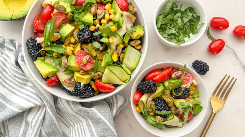 large and small bowl of salad