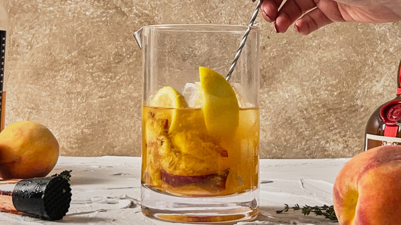 stirring bourbon in glass