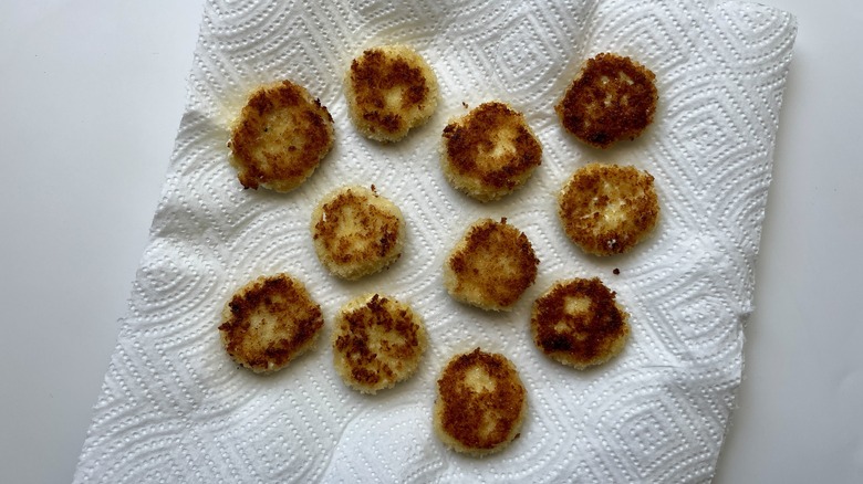 cheese coins on paper towel