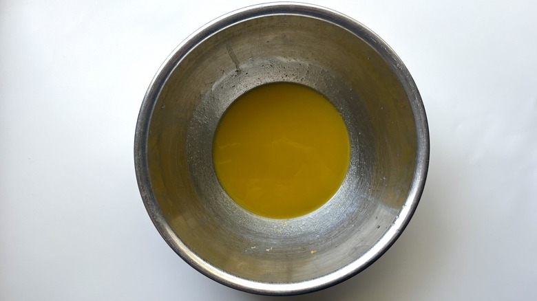 mustard dressing in metal bowl