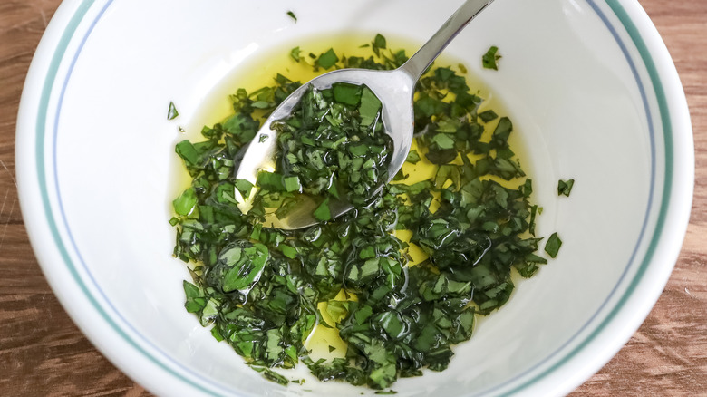 olive oil and basil in a bowl