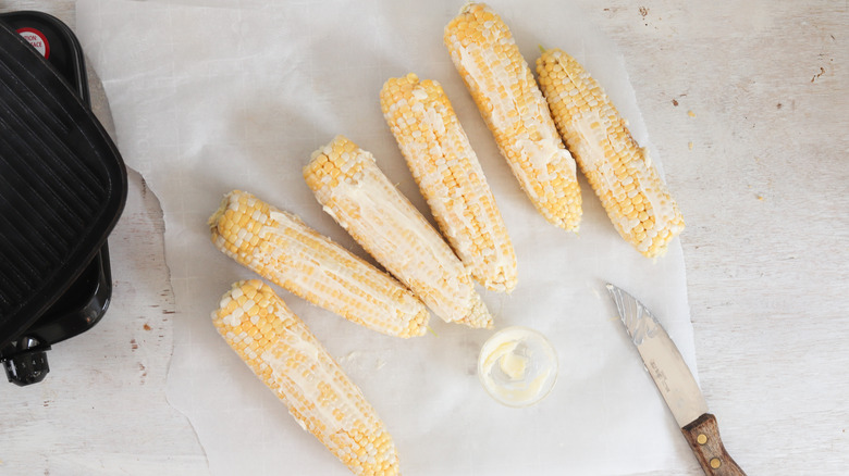 buttered corn ears on board