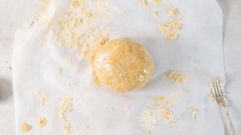 dough ball wrapped in plastic