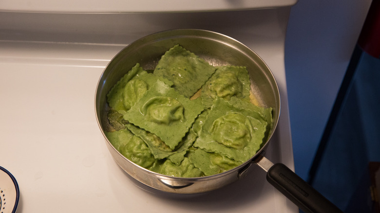 green ravioli in skillet 