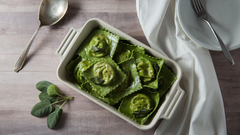 green ravioli in serving dish 