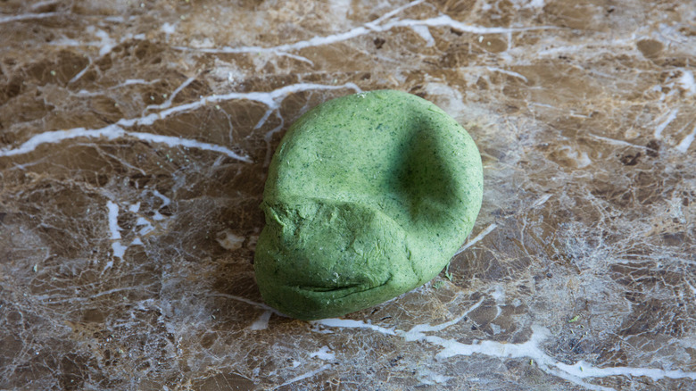ball of green pasta dough