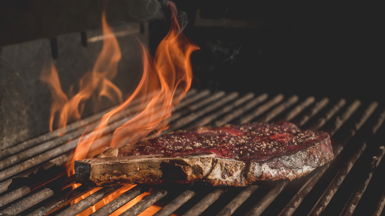 Overcooked steak on grill