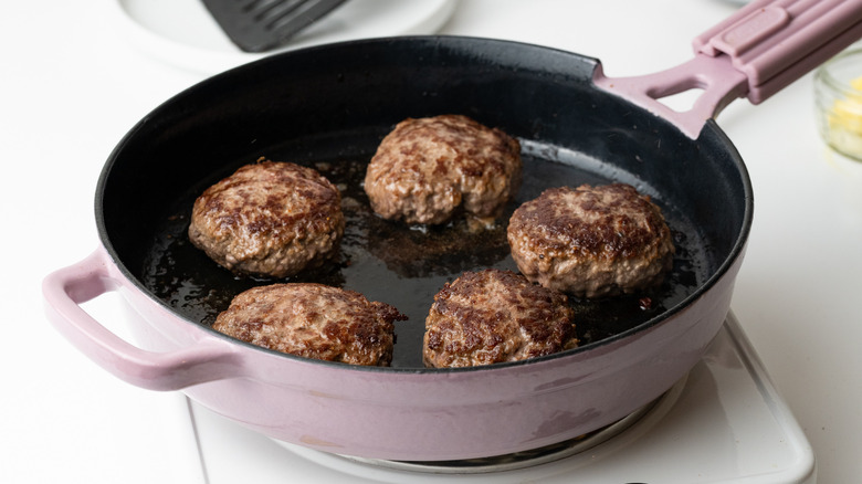 hamburger steaks in large pan 