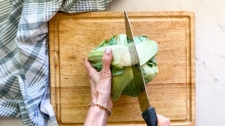 cutting cauliflower with knife 