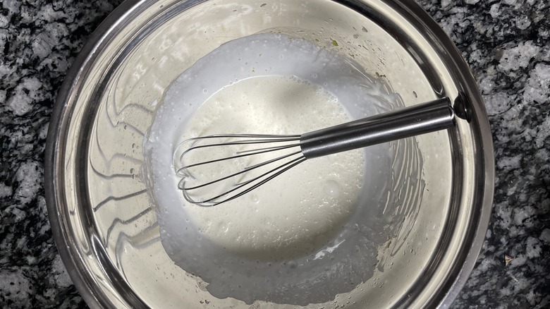 whisking coconut dressing