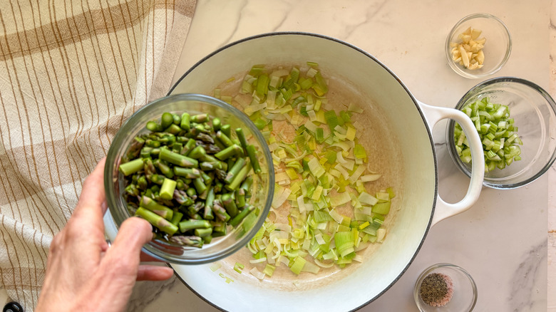 adding asparagus to pot