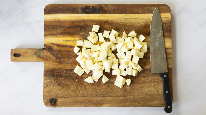 mozzarella cubes on cutting board