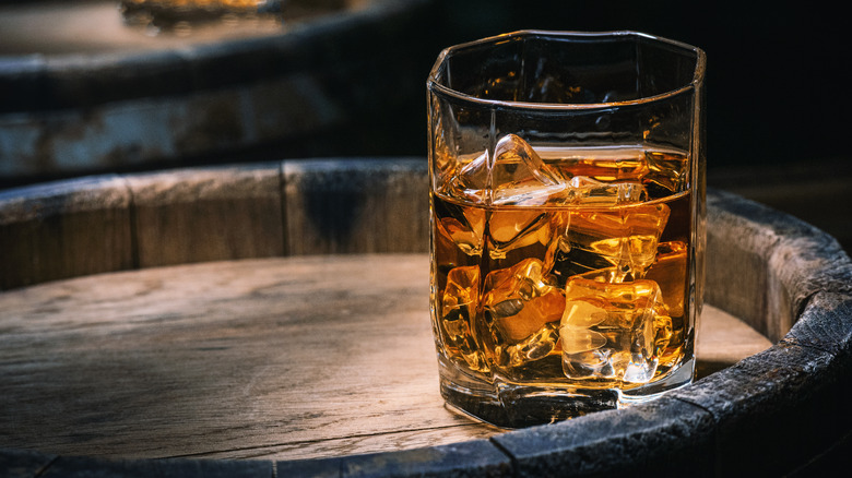 A glass of whiskey with ice