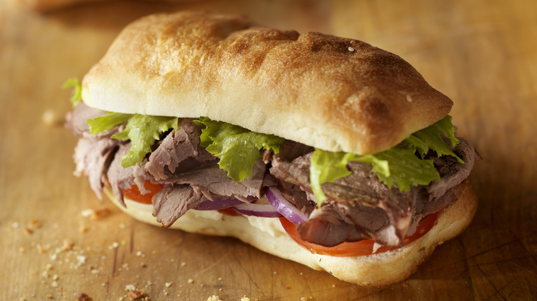 Roast beef sandwich on cutting board 