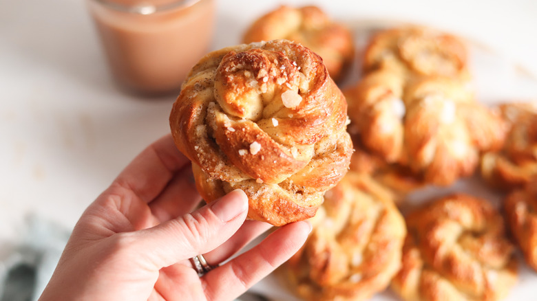 hand holding cardamom buns