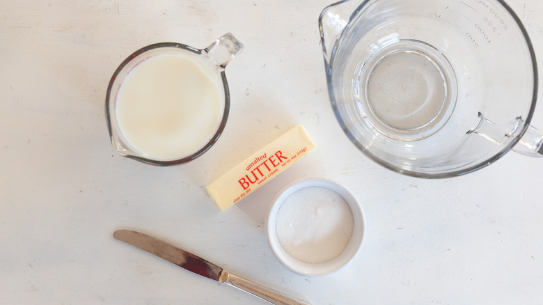 warm milk in a measuring cup