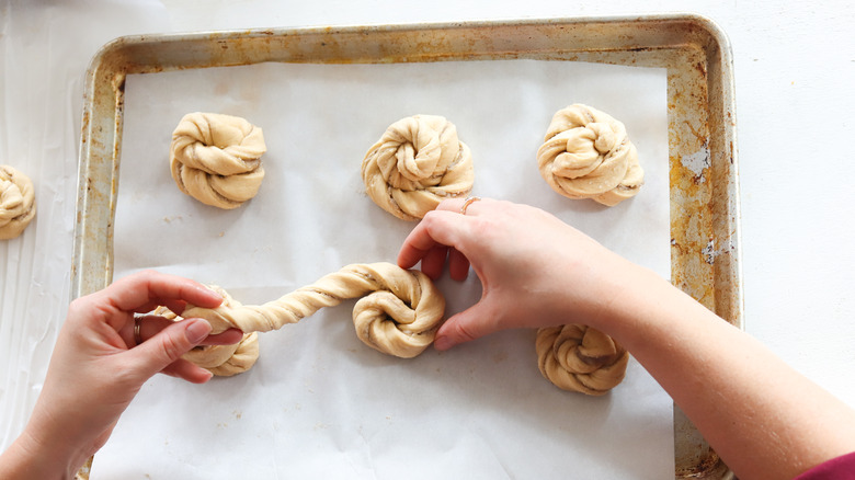 dough strips coiled on baking sheet