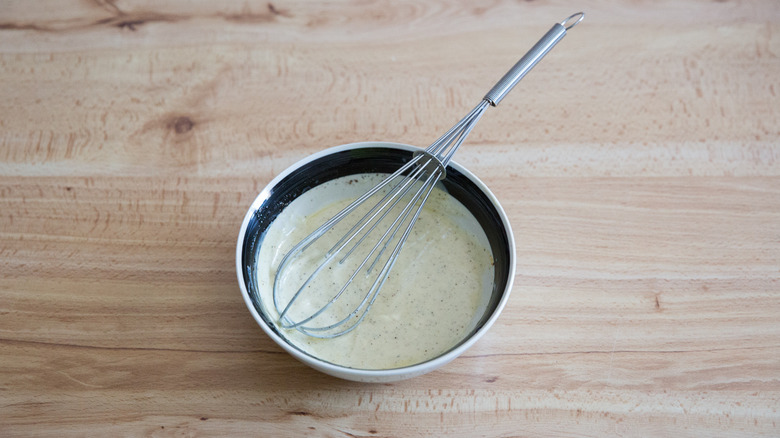 whisked dressing in small bowl