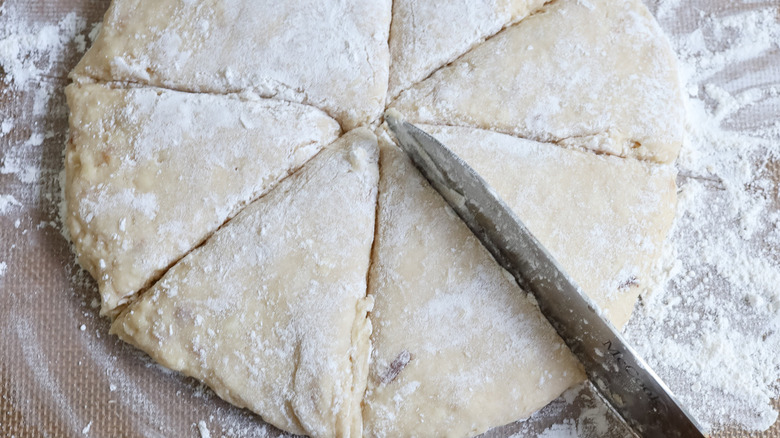 knife slicing into dough