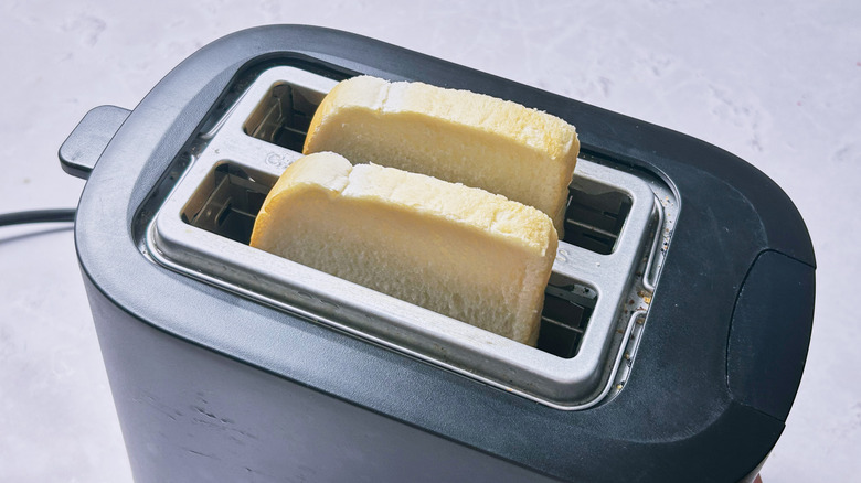 toasting bread in toaster