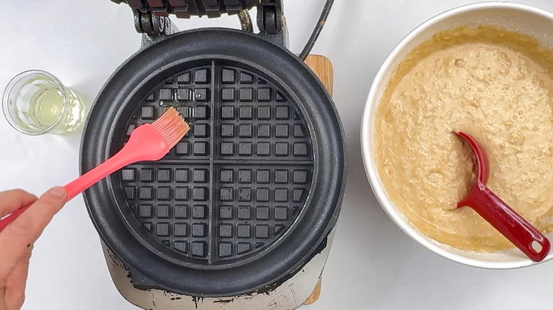 Greasing waffle iron with oil