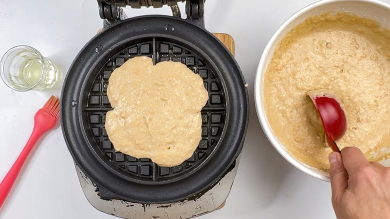 pouring batter in waffle iron