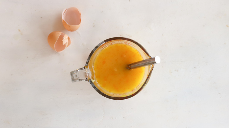 eggs whisked in measuring cup