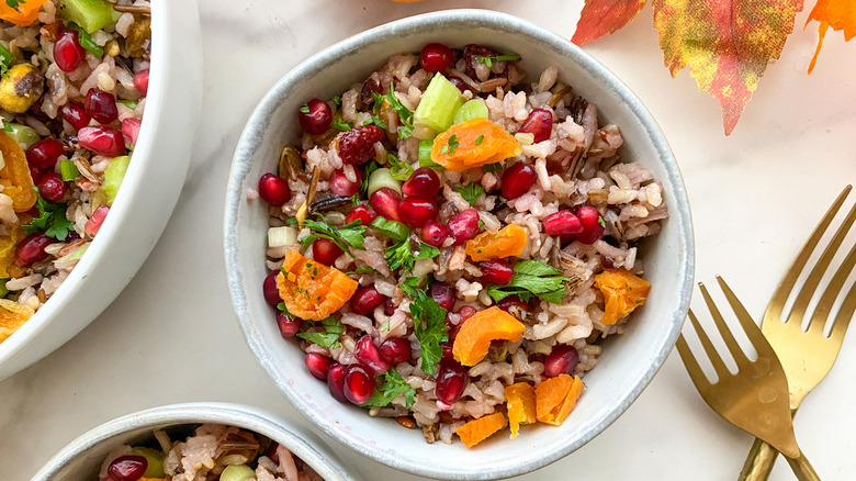 small bowl of rice dish with metal cutlery