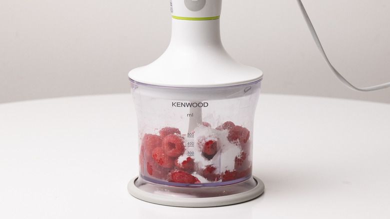 preparing raspberry sauce in blender