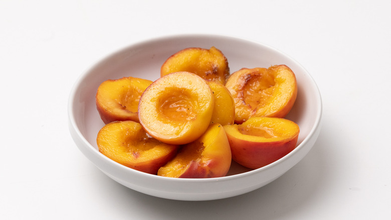 poached peaches in a bowl