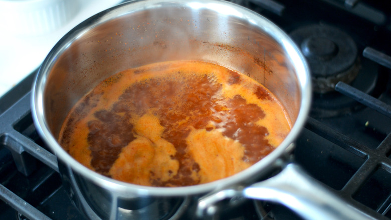 Glaze reducing in a small pot 