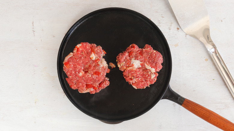 burger patties on griddle