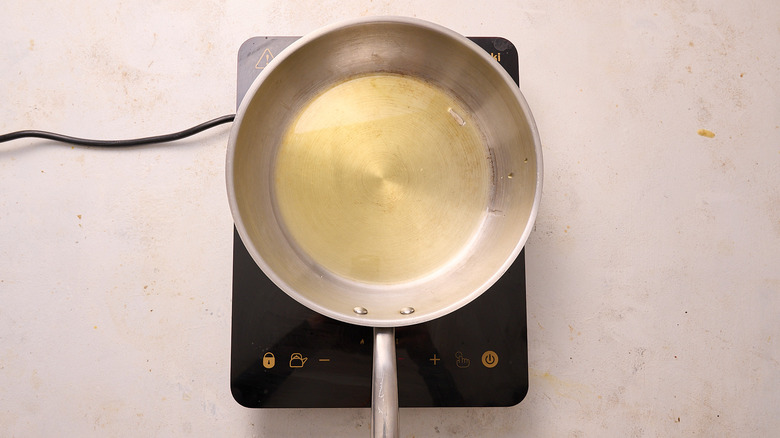 heating oil in a skillet