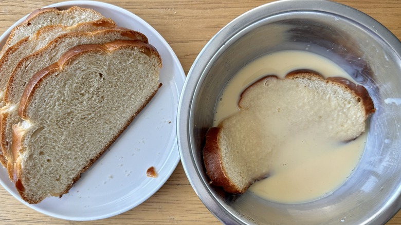 Challah soaking in custard