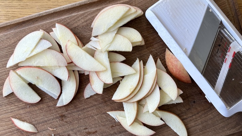 Slicing apples with mandoline