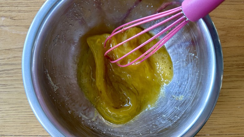 Whisking eggs in bowl