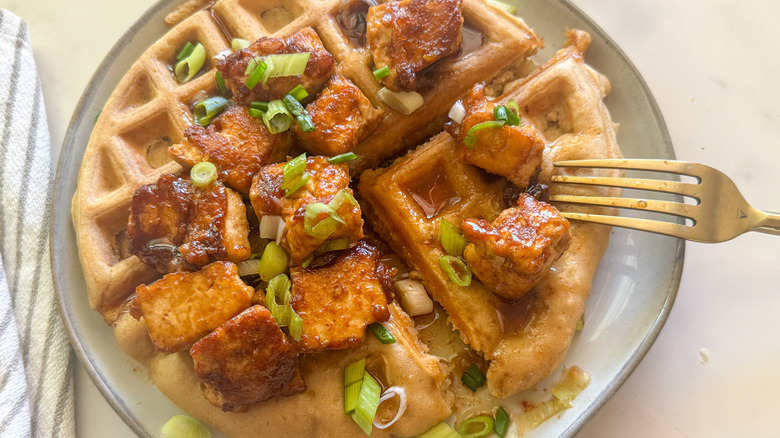 fork on waffle with tofu