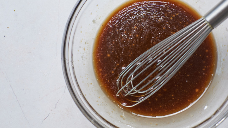 mixing sweet and sticky sauce