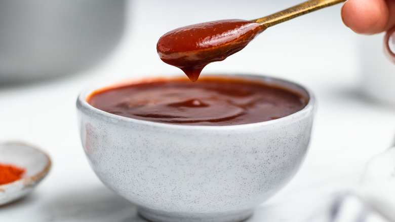 bbq sauce in bowl and spoon