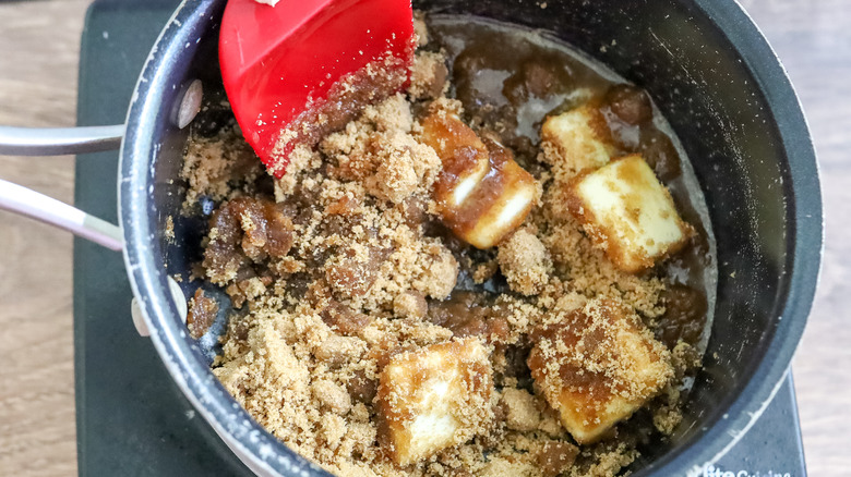 butter and sugar being heated in a pan