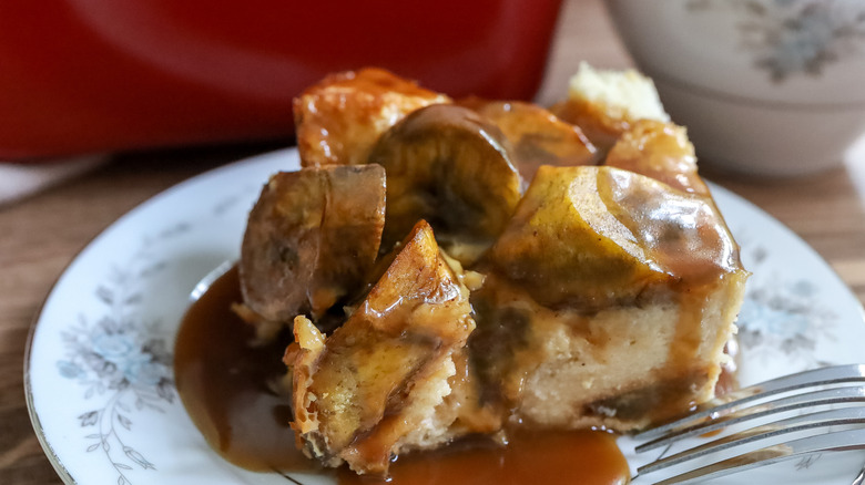 a slice of sweet plantain bread pudding on a plate