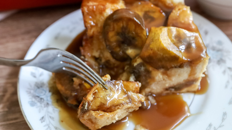 a slice of sweet plantain bread pudding on a plate