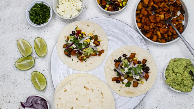 assembling sweet potato tacos