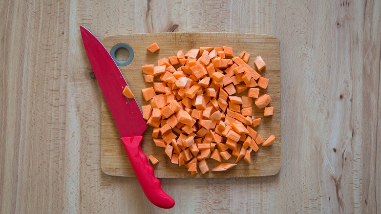 cubed sweet potato on board 