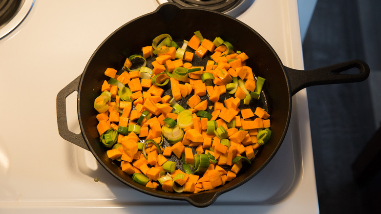 sauteed vegetables in iron skillet 