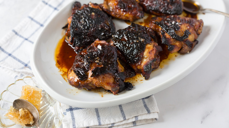 Chicken with honey on a spoon