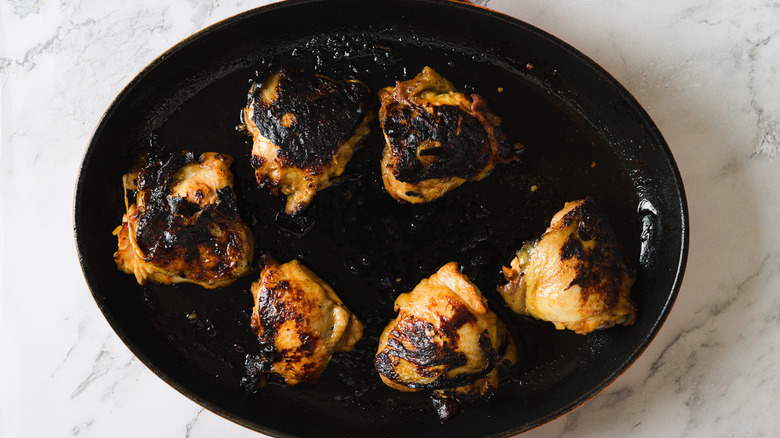 Cooked chicken in cast iron pan