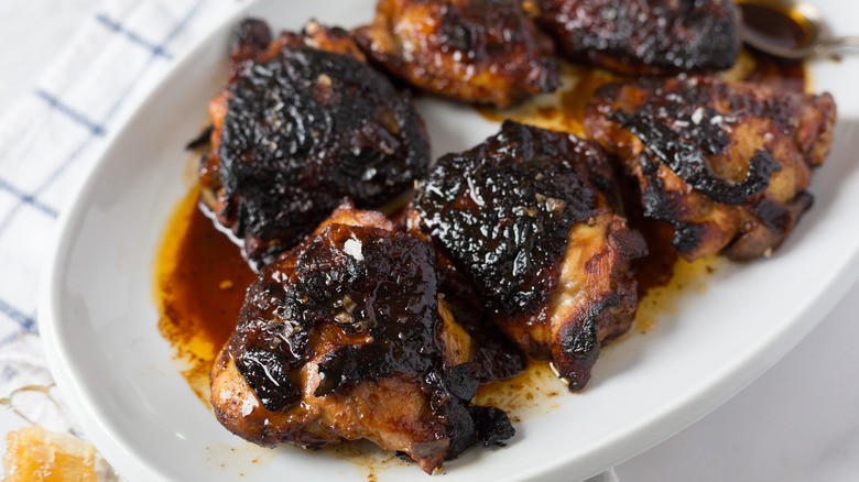 Chicken with honey glaze on white plate