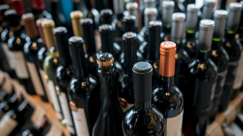 Close-up of many wine bottles on a shelf
