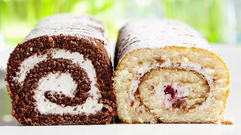 a brown Swiss roll and a white Swiss outside